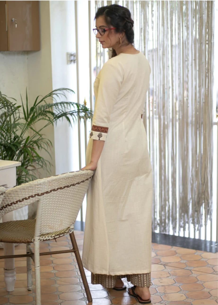 Classy Cotton Flex Off-White Kurta With Embroidered Yoke And Sleeves Paired With Printed Pant