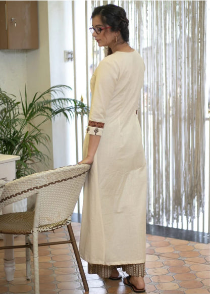 Classy Cotton Flex Off-White Kurta With Embroidered Yoke And Sleeves Paired With Printed Pant